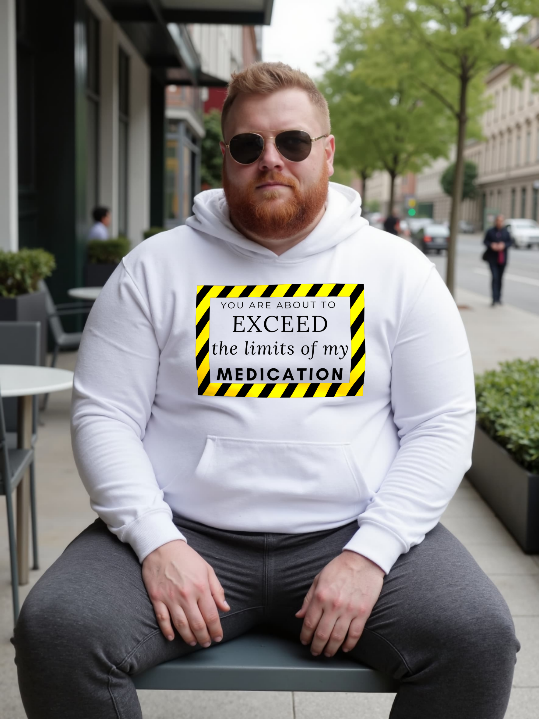 Person wearing a white hoodie with a humorous warning label design.